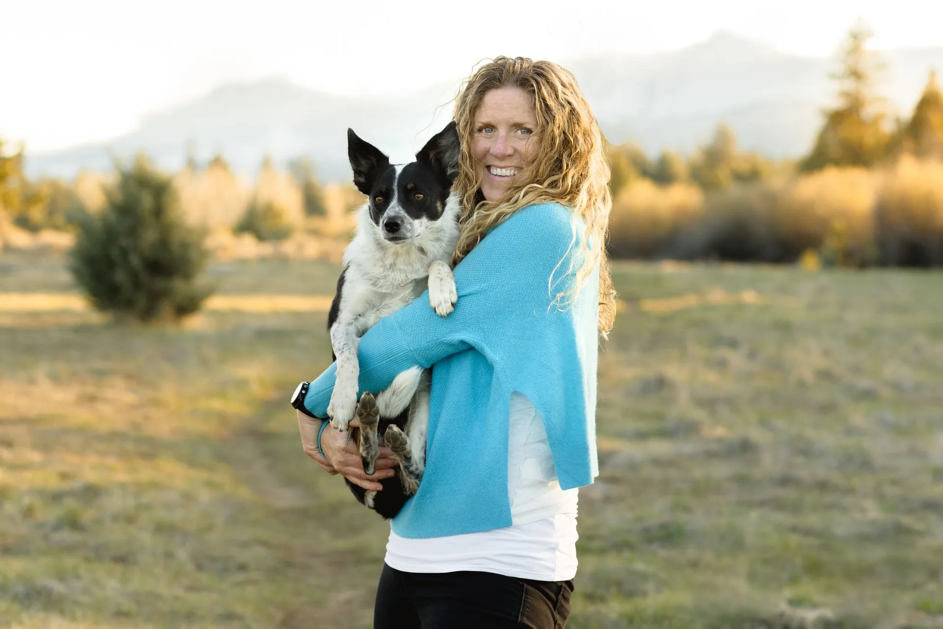 Kelly holding her dog Kiva